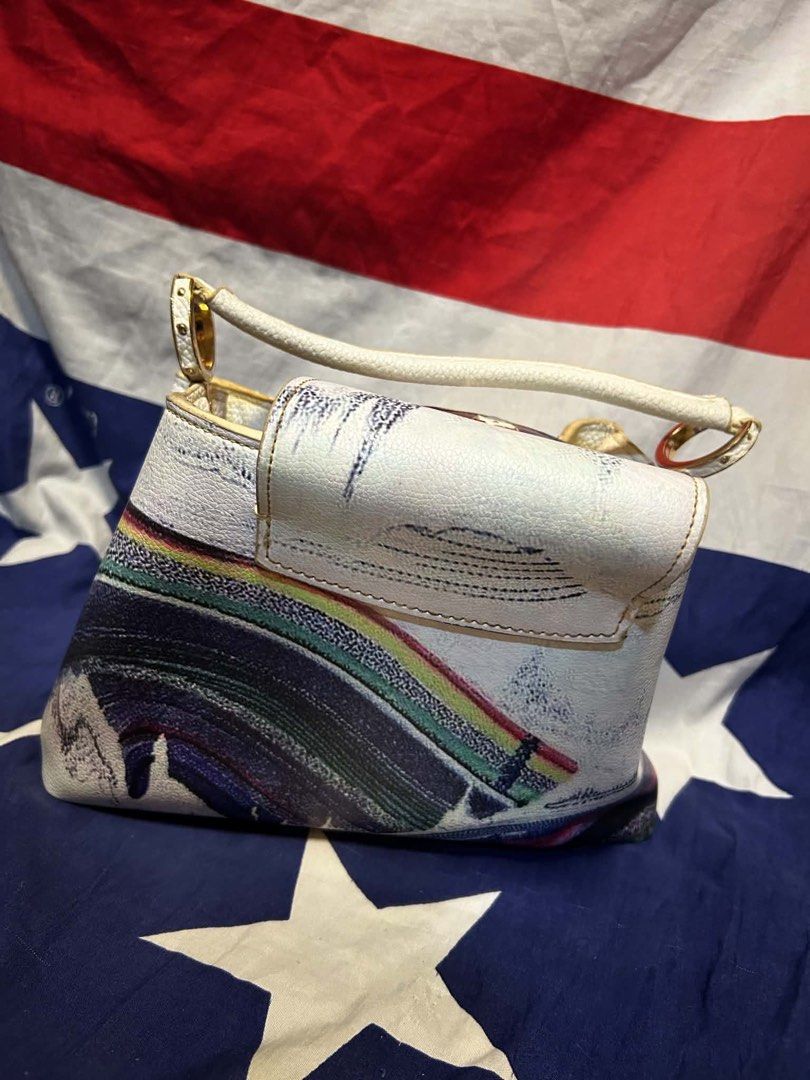 Louis Vuitton Monogram Pochette (Category: Luxury Bags & Wallets) located in Quezon City. Submitted by ozzy04 (Listing ID 1440689734, Image 2). Description: White Louis Vuitton pochette with colorful abstract print. Gold hardware details. Zipper closure. Interior has a black lining. Date code visible inside. Unique design..