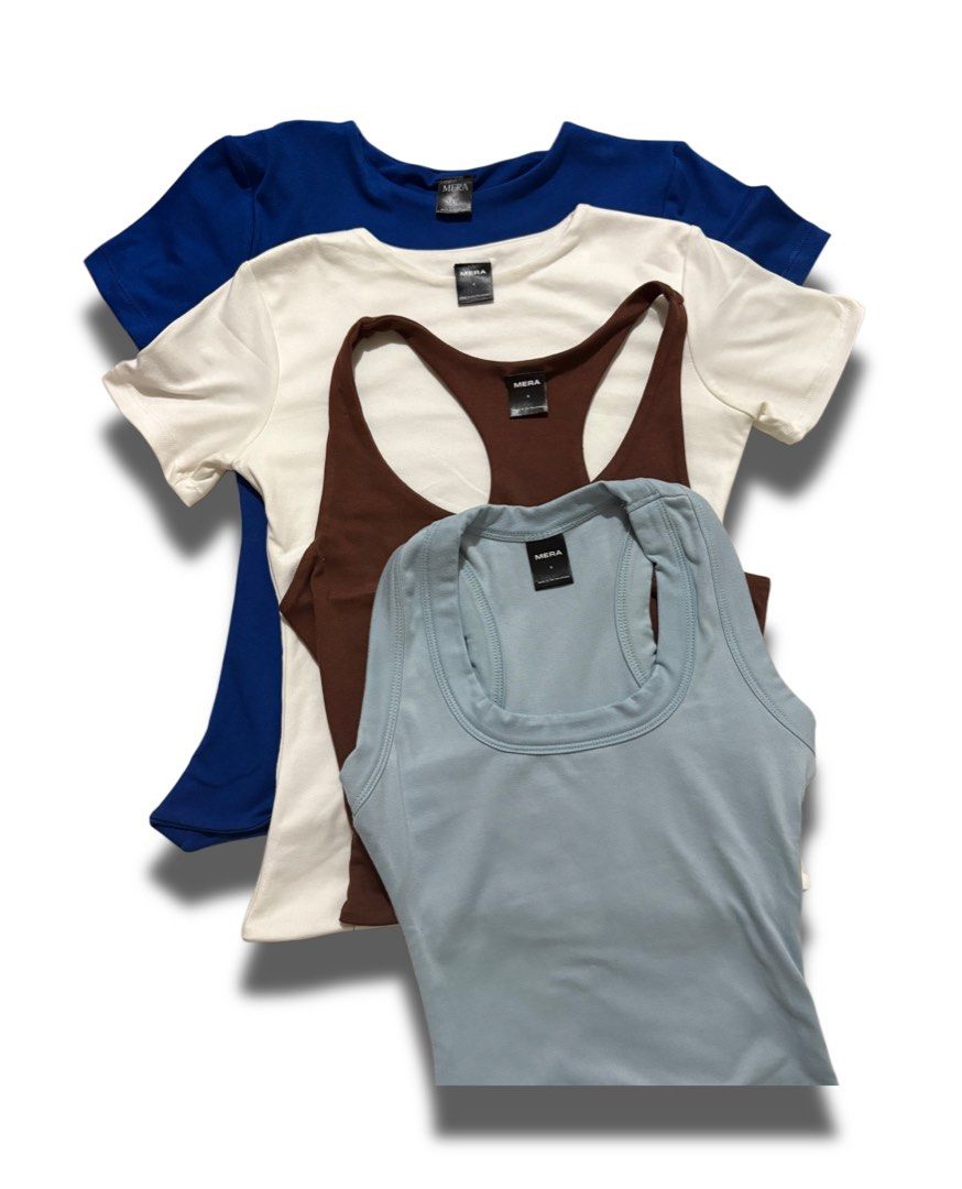 MERA Basic Tank Tops Bundle (Category: Shirts) located in Rizal. Submitted by minnieee1058 (Listing ID 1440592441, Image 1). Description: - Bundle of 4 MEIRA tops - Includes: royal blue t-shirt, off-white t-shirt, brown racerback tank, light blue scoop neck tank - Made from soft and comfortable fabric - Perfect for layering or wearing solo - Versatile additions to any wardrobe.