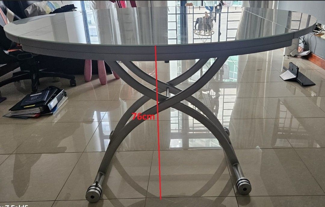 Multi Function Dining / Coffee Glass Table (Category: Tables & Sets) located in Singapore. Submitted by sg-wlt (Listing ID 1440602297, Image 1). Description: 1. Adjustable height 42cm - 76cm 2. Can be used as a) Round dining table (120cm). b) Rectangular coffee table (79cm). 3. Cash and carry (West Coast)..