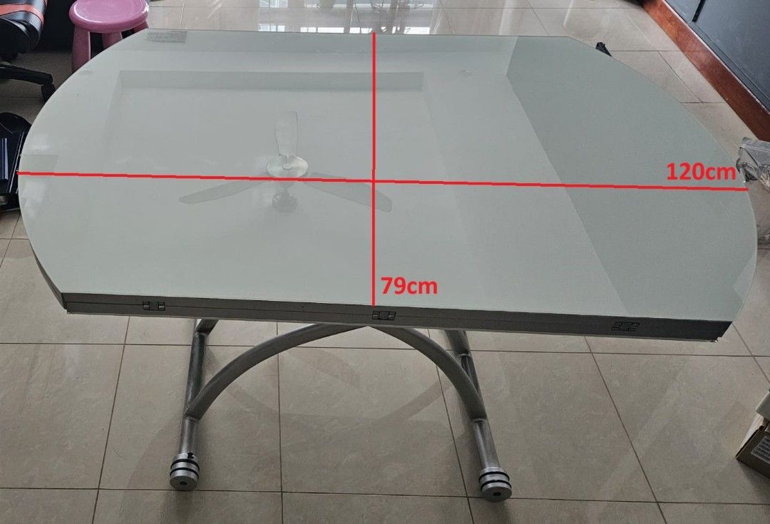 Multi Function Dining / Coffee Glass Table (Category: Tables & Sets) located in Singapore. Submitted by sg-wlt (Listing ID 1440602297, Image 3). Description: 1. Adjustable height 42cm - 76cm 2. Can be used as a) Round dining table (120cm). b) Rectangular coffee table (79cm). 3. Cash and carry (West Coast)..