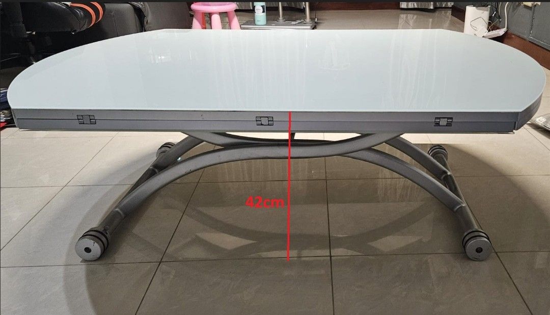 Multi Function Dining / Coffee Glass Table (Category: Tables & Sets) located in Singapore. Submitted by sg-wlt (Listing ID 1440602297, Image 2). Description: 1. Adjustable height 42cm - 76cm 2. Can be used as a) Round dining table (120cm). b) Rectangular coffee table (79cm). 3. Cash and carry (West Coast)..