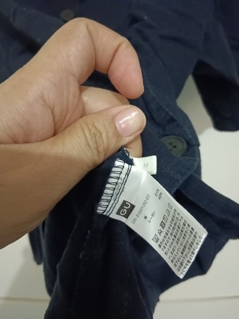 Navy Blue Button-Up Short Sleeve Shirt (Category: Blouses) located in Rizal. Submitted by mommathings (Listing ID 1440620837, Image 2). Description: - Classic navy blue short sleeve shirt - Features a collar and button-up front - Made from a linen or linen blend fabric - Relaxed fit for comfortable, casual wear - Versatile and easy to pair with any outfit.