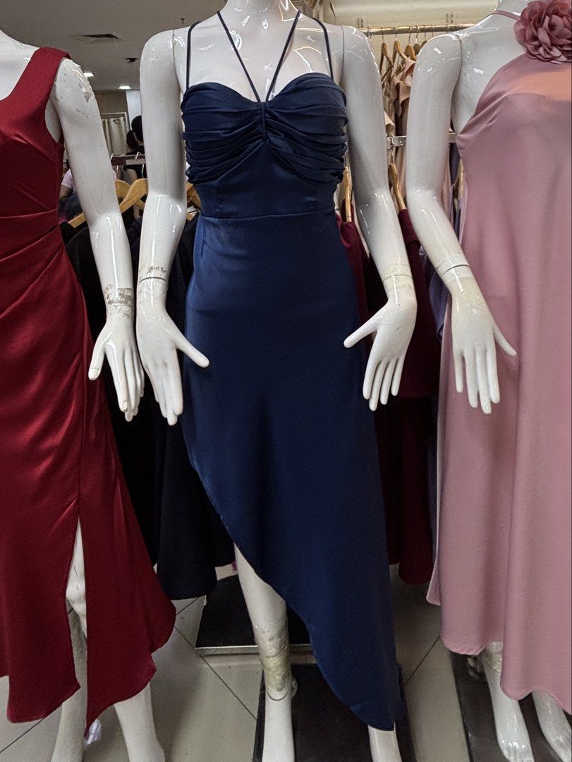 Navy Blue Satin Midi Dress (Category: Dresses) located in Manila. Submitted by wintermelonmilktea2003 (Listing ID 1440736620, Image 1). Description: - Best fits S-M - Chic navy blue midi dress - Elegant spaghetti straps - Flattering ruched bust detail - Stylish asymmetrical hemline - Fabric with a beautiful sheen - Ideal for special events or a night out - Great fit, as seen in mirror selfie.