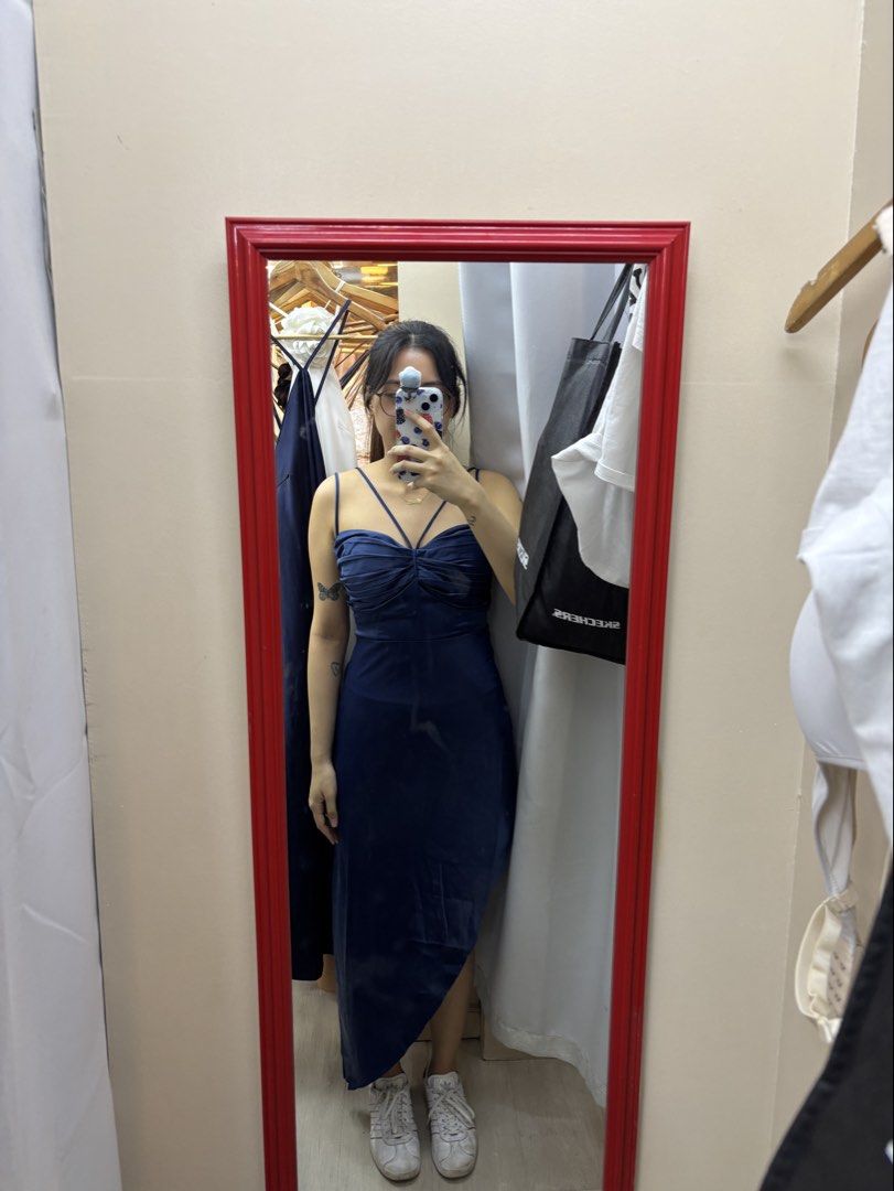 Navy Blue Satin Midi Dress (Category: Dresses) located in Manila. Submitted by wintermelonmilktea2003 (Listing ID 1440736620, Image 2). Description: - Best fits S-M - Chic navy blue midi dress - Elegant spaghetti straps - Flattering ruched bust detail - Stylish asymmetrical hemline - Fabric with a beautiful sheen - Ideal for special events or a night out - Great fit, as seen in mirror selfie.