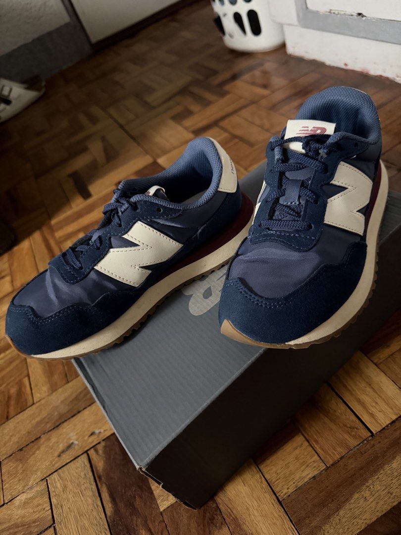 New Balance 237 Navy White Sneakers (Category: Sneakers) located in Paranaque City. Submitted by maineacct (Listing ID 1440631632, Image 3). Description: - Classic New Balance 237 sneakers - Color: Navy blue with cream 'N' logo - Features a gum sole for excellent grip - Includes original box - Ideal for casual and everyday wear -Size: US4 (can fit big kids or adults with small feet).