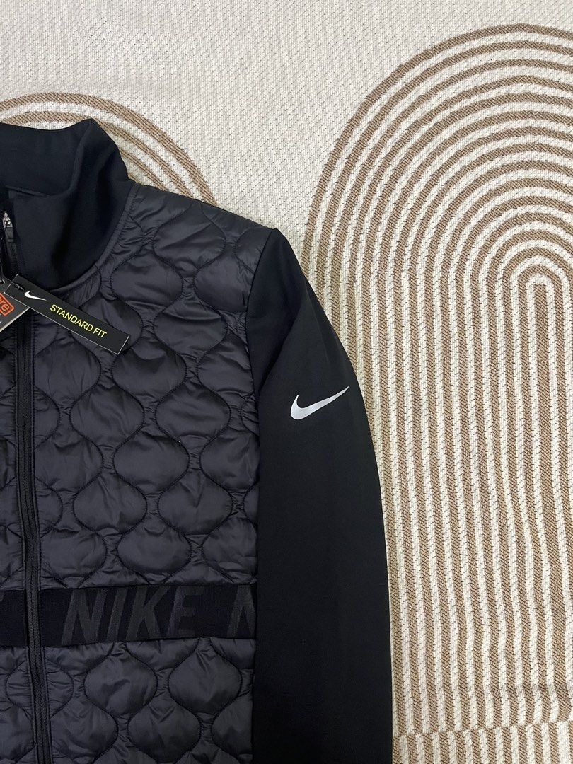 Nike Aeroloft Therma-FIT Quilted Jacket (Category: Coats, Jackets and Outerwear) located in Candaba. Submitted by thriftshitsph01 (Listing ID 1440689261, Image 2). Description: - Nike Therma-FIT & Aeroloft technology for superior warmth - Quilted front panel for insulation - Long sleeves for full coverage - Nike branding across the waist for a stylish touch - Standard fit for comfortable wear - Ideal for workouts or everyday casual use - Brand ne