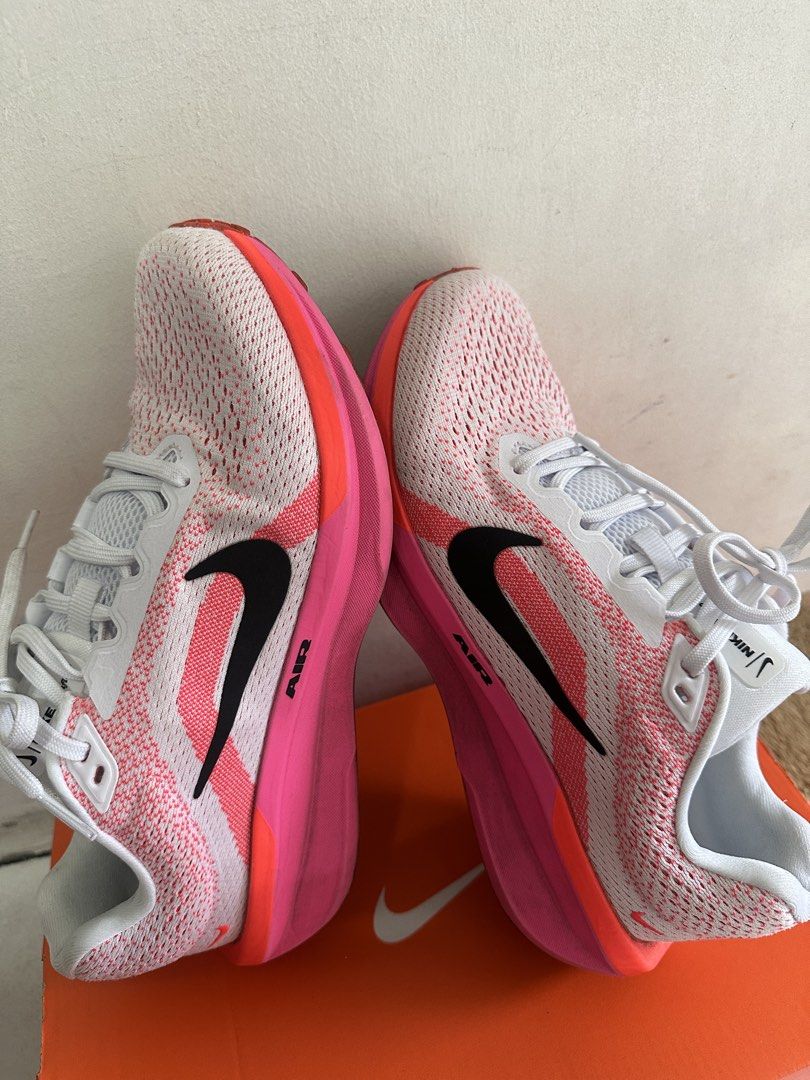 Nike Air Zoom Running Shoes (Category: Sneakers) located in Makati City. Submitted by preloved.sbm (Listing ID 1440580932, Image 2). Description: - Nike Air Zoom running shoes - Color: White with pink and orange accents - Size: Women's US 5.5 / EUR 39 - Includes original box - Ideal for running and everyday wear With box Original What you see is what you get Rfs: doctor recommended a diff shoes.