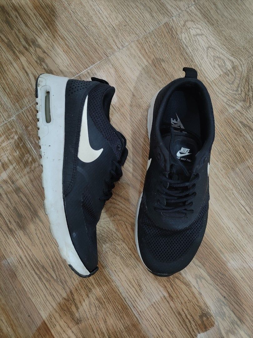 Nike black sneakers Thea womens shoes (with box) (Category: Sneakers) located in Cavite. Submitted by itstrish23 (Listing ID 1440623237, Image 1). Description: original mall bought size US 6.5 womens slightly nego with major flaw: matatanggal na pagkaka dikit ng outsole but this can be easily repaired after that magagamit pa sya talaga (see last photos) needs cleaning lang pero goods pa to rfs: decluttering seller from Cavite 😊.