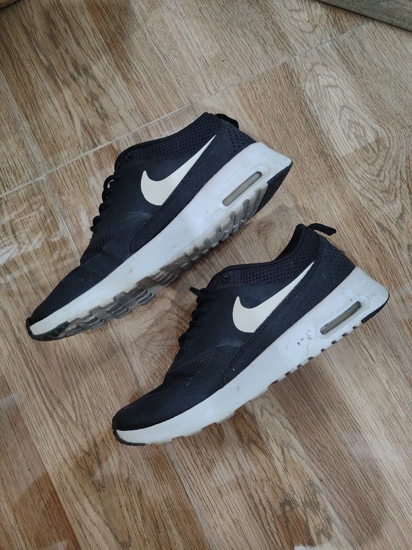 Nike black sneakers Thea womens shoes (with box) (Category: Sneakers) located in Cavite. Submitted by itstrish23 (Listing ID 1440623237, Image 2). Description: original mall bought size US 6.5 womens slightly nego with major flaw: matatanggal na pagkaka dikit ng outsole but this can be easily repaired after that magagamit pa sya talaga (see last photos) needs cleaning lang pero goods pa to rfs: decluttering seller from Cavite 😊.