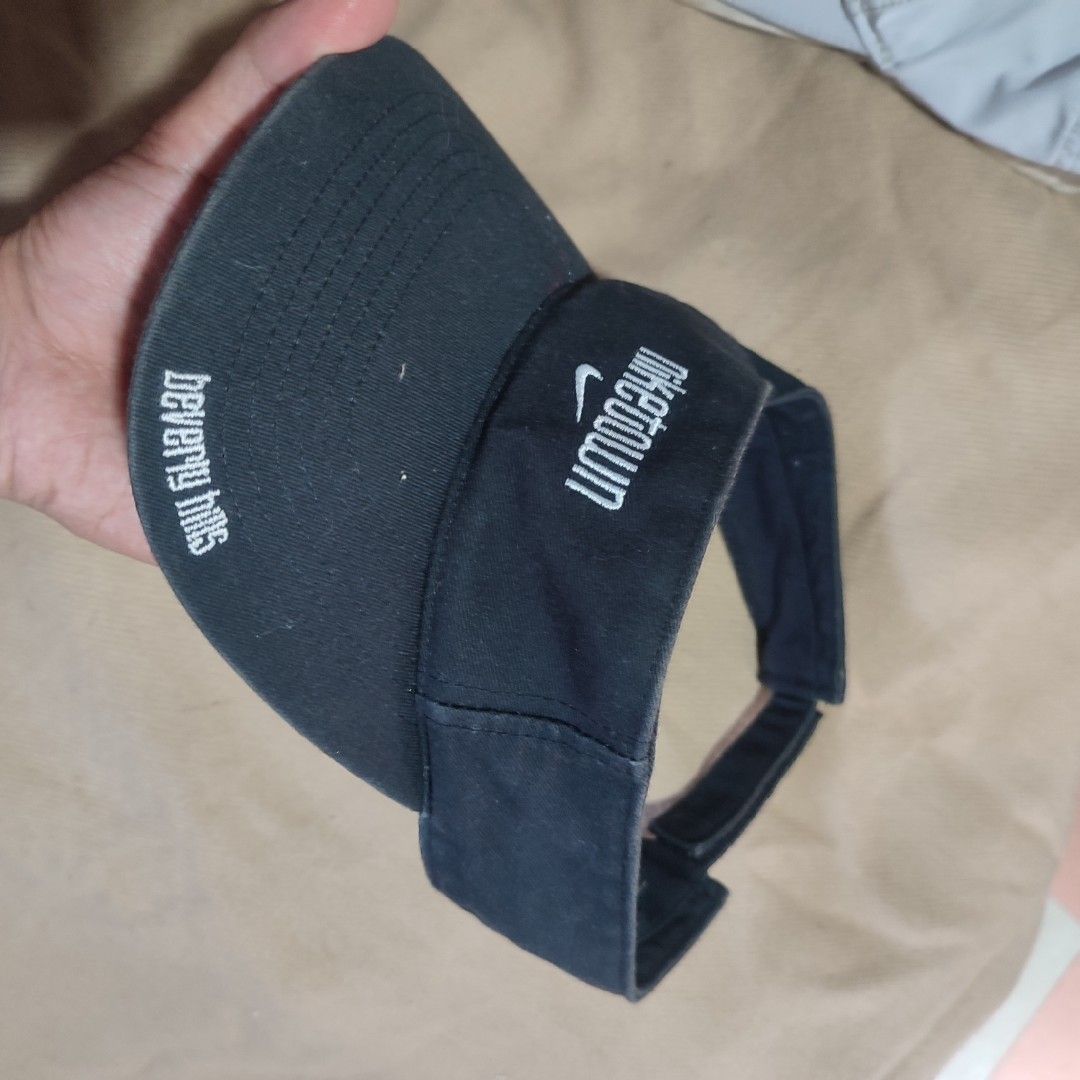 Nike Canvas Visor - NIKETOWN Beverly Hills (Category: Hats & Beanies) located in Baguio. Submitted by shmily01 (Listing ID 1440654242, Image 2). Description: - Vintage Nike canvas visor - Features 'NIKETOWN Beverly Hills' embroidery - Includes iconic Nike swoosh logo - Adjustable velcro strap for a comfortable fit - 'SAMPLE' tag inside - Item requires washing #nike #nikehat.