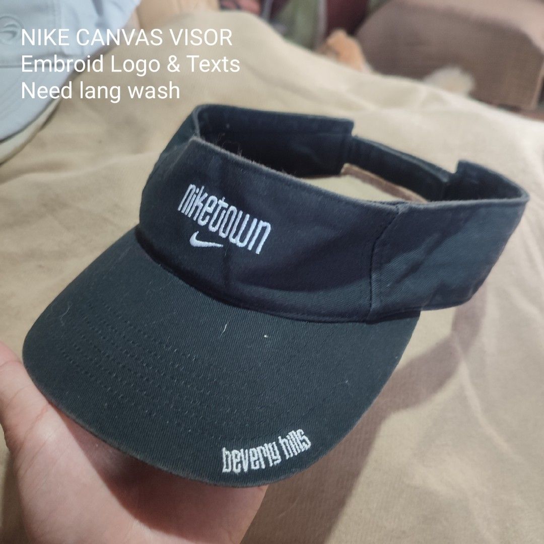 Nike Canvas Visor - NIKETOWN Beverly Hills (Category: Hats & Beanies) located in Baguio. Submitted by shmily01 (Listing ID 1440654242, Image 1). Description: - Vintage Nike canvas visor - Features 'NIKETOWN Beverly Hills' embroidery - Includes iconic Nike swoosh logo - Adjustable velcro strap for a comfortable fit - 'SAMPLE' tag inside - Item requires washing #nike #nikehat.