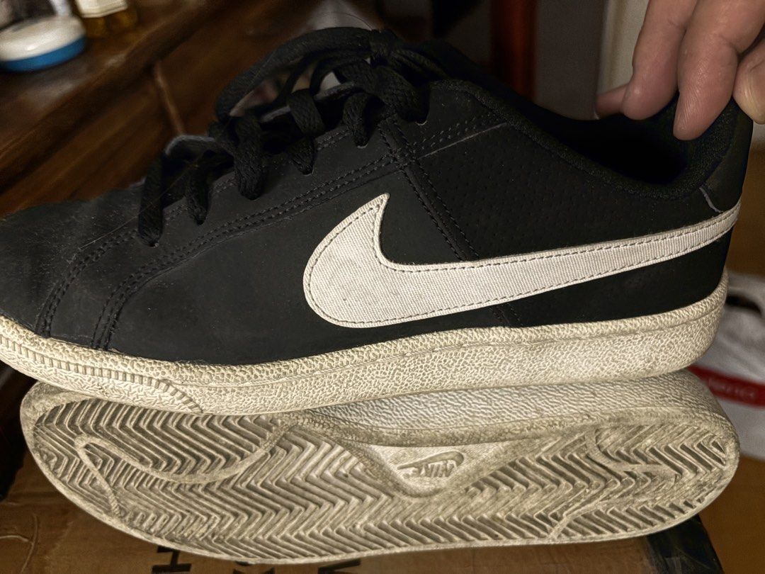 Nike Court Royale sneaker (Category: Sneakers) located in Quezon City. Submitted by dtzee (Listing ID 1440675669, Image 2). Description: - Classic black Nike sneakers courtside - Iconic white swoosh detail - Soles have good tread remaining - Minor signs of wear on soles and uppers - Plenty of life left for everyday wear Seldom use Size 7.5US.