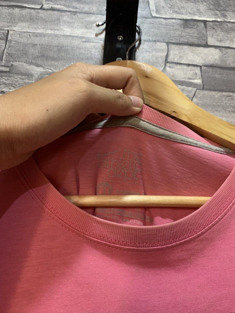 Nike Graphic T-Shirt Pink (Category: Tshirts & Polo Shirts ) located in Quezon City. Submitted by jenggg24 (Listing ID 1440748950, Image 2). Description: - Pink Nike T-shirt - Features a cool graphic print of a cartoon character playing basketball - Made of 100% cotton - Ideal for casual wear - Please check photos for detailed condition.