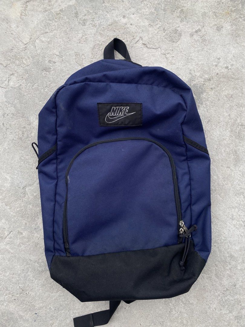 Nike Navy Blue Polyester Backpack (Category: Backpacks) located in Manila. Submitted by keenriver-4b36 (Listing ID 1440655712, Image 1). Description: - Classic navy blue Nike backpack - Made from 100% polyester - Main compartment with internal pockets - Front zip pocket for easy access - Adjustable padded shoulder straps for comfort - Ideal for school, work, or everyday adventures - Proudly made in Korea.