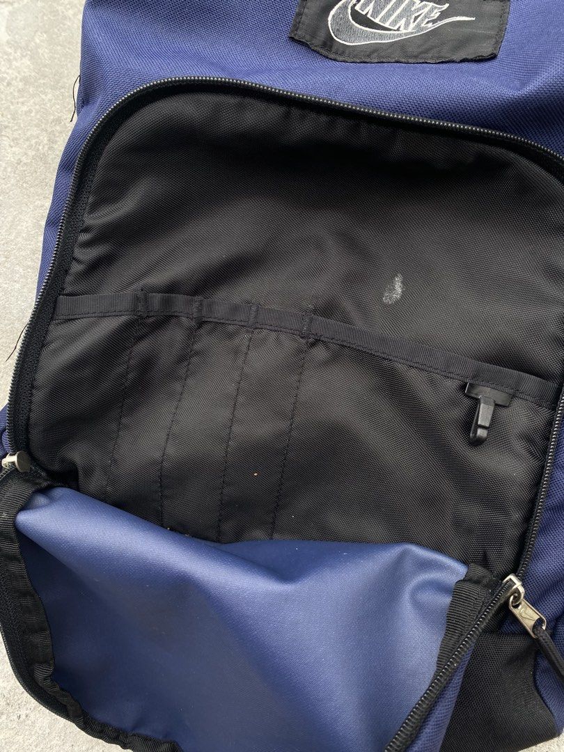Nike Navy Blue Polyester Backpack (Category: Backpacks) located in Manila. Submitted by keenriver-4b36 (Listing ID 1440655712, Image 3). Description: - Classic navy blue Nike backpack - Made from 100% polyester - Main compartment with internal pockets - Front zip pocket for easy access - Adjustable padded shoulder straps for comfort - Ideal for school, work, or everyday adventures - Proudly made in Korea.