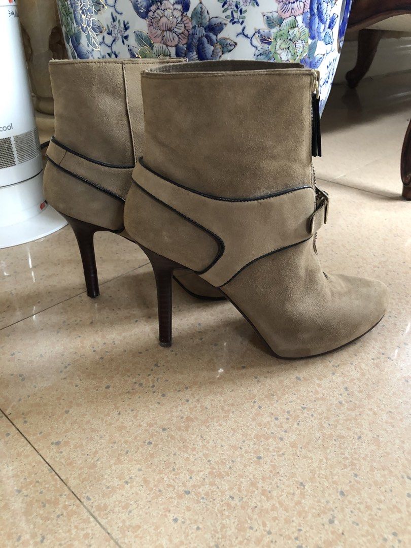 Nine West Suede Heeled Ankle Boots (Category: Boots) located in Davao. Submitted by stylecircuit (Listing ID 1440622531, Image 1). Description: - Nine West tan suede ankle boots - Zip-up front with buckle detail - High stiletto heel - Versatile: great for dressing up or down - Comfortable for a night out.