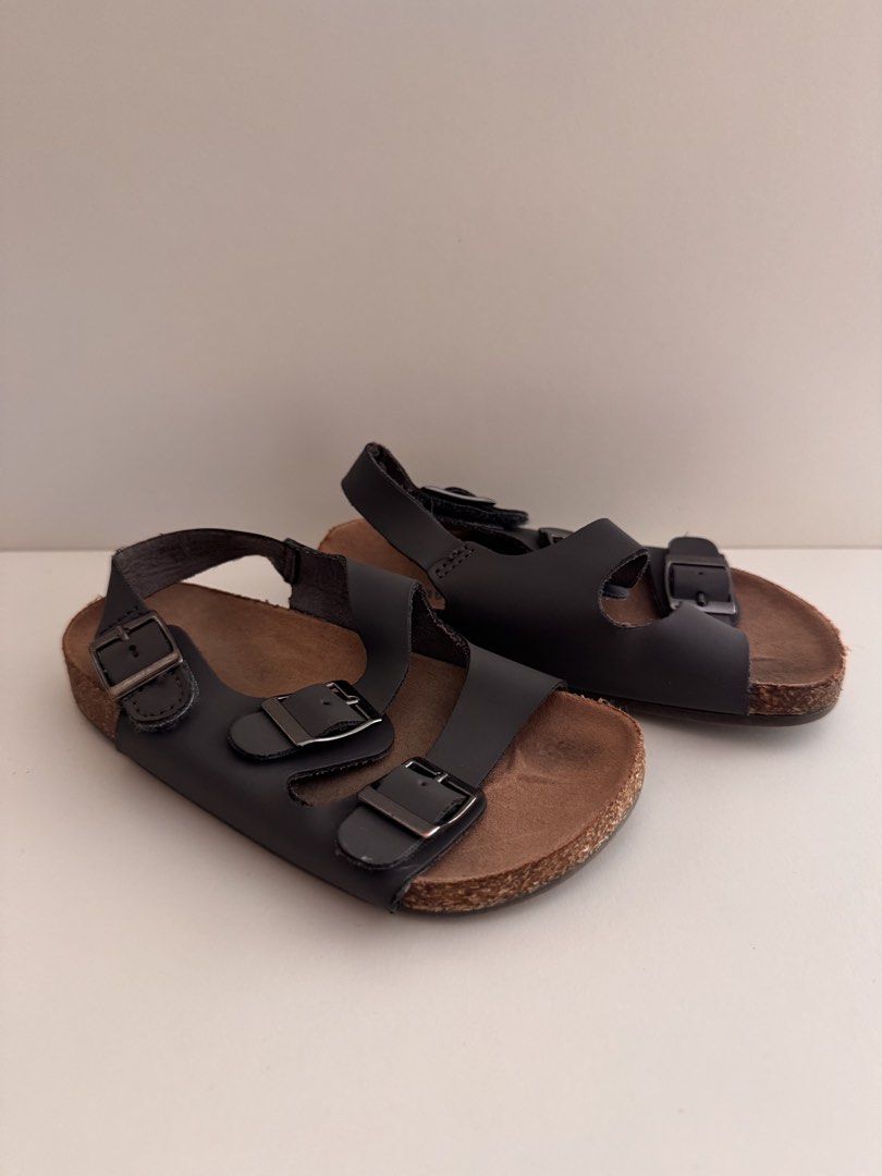 Old Navy Dark Grey Buckle Strap Cork Sandals (Category: Babies & Kids Fashion) located in Manila. Submitted by patrishtrishhh (Listing ID 1440606108, Image 3). Description: - size 25 - Dark grey sandals from Old Navy - Features a comfortable cork sole - Adjustable buckle straps for a secure fit - Easy for kids to wear - Ideal for summer outings - Stylish and comfortable.