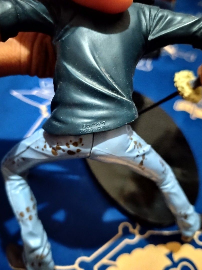 One Piece Trafalgar Law Banpresto Figure (Category: Toys & Games) located in Manila. Submitted by vastmoon_0d6970 (Listing ID 1440623174, Image 3). Description: - Trafalgar Law action figure from One Piece - Comes with his signature sword and stand - Original box included - Box shows some signs of wear - A must-have for any One Piece fan's collection.