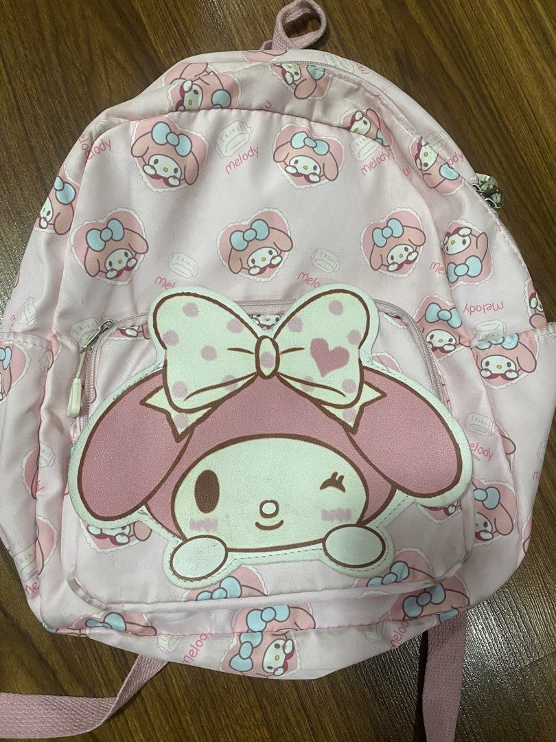 My Melody Kid’s Backpack (Category: Babies & Kids Fashion) located in Makati City. Submitted by ann.declutter (Listing ID 1440653789, Image 1). Description: - Adorable pink backpack featuring a repeating My Melody pattern. - Large My Melody applique on the front pocket. - Stylish silver-toned zippers. - Adjustable straps for a comfortable fit. - Ideal for school, travel, or everyday adventures..