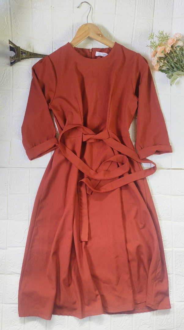 Plain Midi Dress with Belt (Category: Dresses) located in Tagbilaran City. Submitted by grazie95 (Listing ID 1440622502, Image 2). Description: - Plain Haven midi dress in a beautiful red color. - Features a tie belt to cinch the waist. - Three-quarter length sleeves that can be cuffed. - Convenient back zipper closure. - Versatile for both casual outings and dressing up. can fit up to large.
