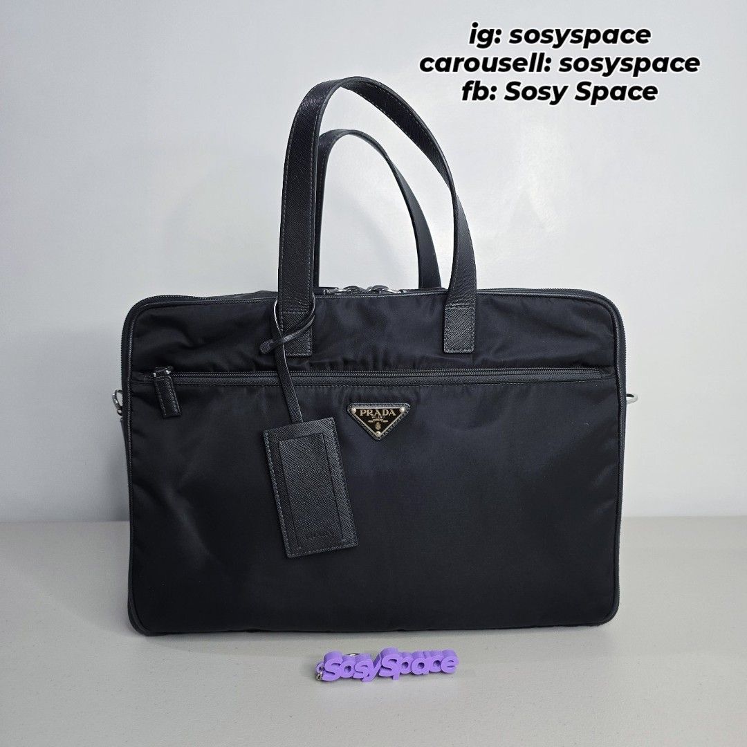 PRADA Black Nylon Briefcase Travel Bag Document Bag (Category: Luxury Bags & Wallets) located in Lucena. Submitted by sosyspace (Listing ID 1440628525, Image 3). Description: P. R. A. D. A. L42062407B1P263 Black Nylon Briefcase / Travel Bag 42x15x30cm inclusions: bag, removable/adjustable sling strap, lock, and luggage tag Condition: PRELOVED Excellent used condition. Price: Php 29,500 + HF + SF (Best Price Already. No More Haggling Please!😘) --