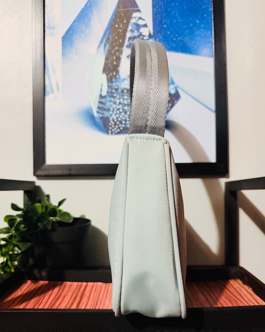 PRADA RE-EDITION NYLON BAG (Category: Luxury Bags & Wallets) located in Infanta. Submitted by christianodelrosario0700 (Listing ID 1440676571, Image 3). Description: Prada Re-Edition Nylon Bag Guaranteed authentic Personal preloved Sky Blue Color Minimal signs of usage, barely used 10/10 excellent condition Bought from Japan 🇯🇵 💫If you know Amore Vintage Shop no inclusion but have different Dust bag From other brand note: color may vary due to