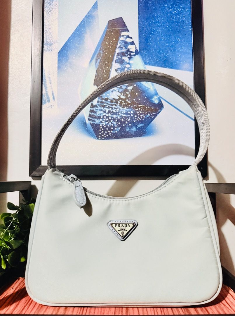 PRADA RE-EDITION NYLON BAG (Category: Luxury Bags & Wallets) located in Infanta. Submitted by christianodelrosario0700 (Listing ID 1440676571, Image 1). Description: Prada Re-Edition Nylon Bag Guaranteed authentic Personal preloved Sky Blue Color Minimal signs of usage, barely used 10/10 excellent condition Bought from Japan 🇯🇵 💫If you know Amore Vintage Shop no inclusion but have different Dust bag From other brand note: color may vary due to