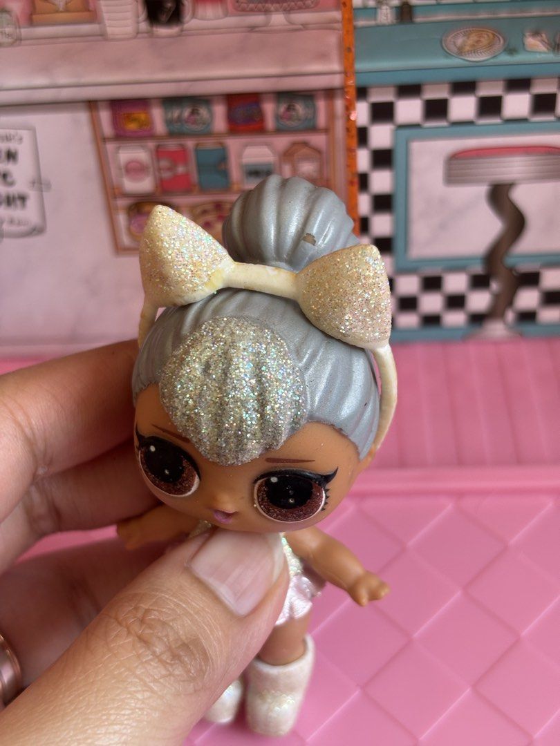 PRELOVED LOL SURPRISE DOLL-KITTY QUEEN (Category: Kids Toys) located in Bulacan. Submitted by lmsdeclutteringcorner (Listing ID 1440663109, Image 3). Description: - LOL Surprise doll - Features silver hair - Comes with a sparkly outfit and matching boots - Includes a pink cup accessory - 1 lol storage included -ISSUE: Discoloration sa headband and top na damit ng doll - Great for collectors and playtime.