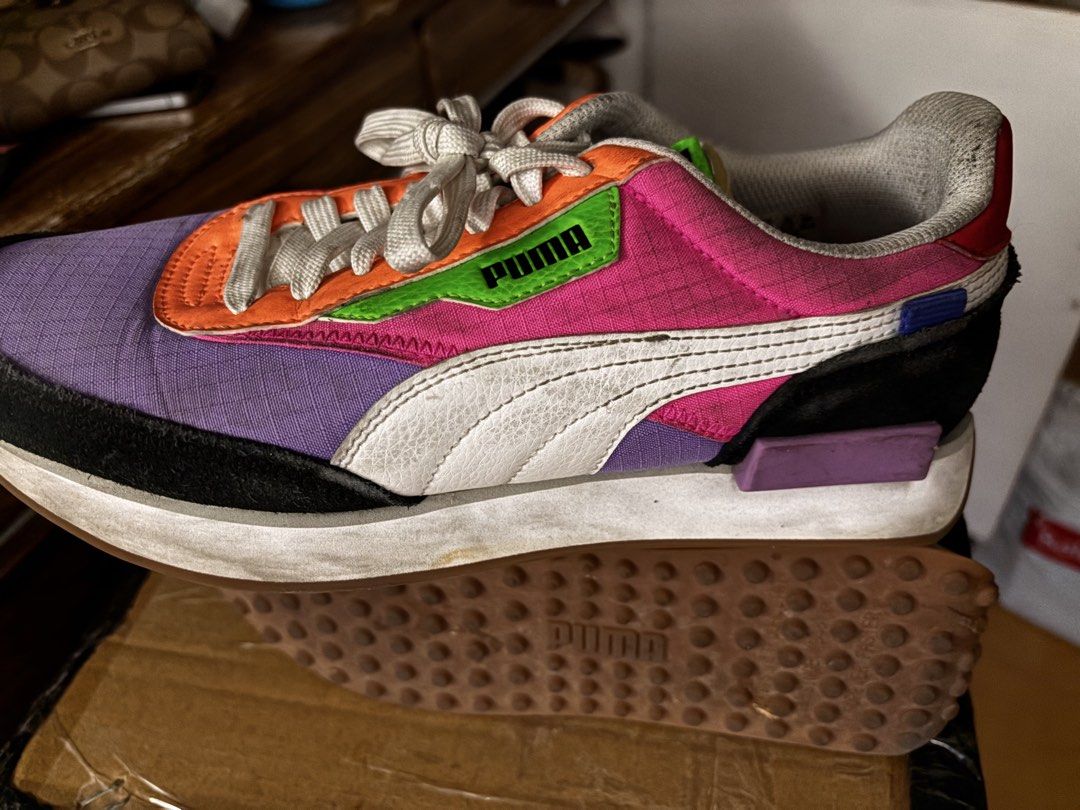 Puma Future Rider Play On Sneakers (Category: Sneakers) located in Quezon City. Submitted by dtzee (Listing ID 1440675398, Image 2). Description: - Puma Future Rider Play On sneakers - Vibrant multi-color design: purple, pink, orange, green accents - Clean white laces and soles - Iconic Puma branding on side and tongue - Perfect for everyday casual wear - Shows some signs of wear on soles and uppers Size 8.5US.