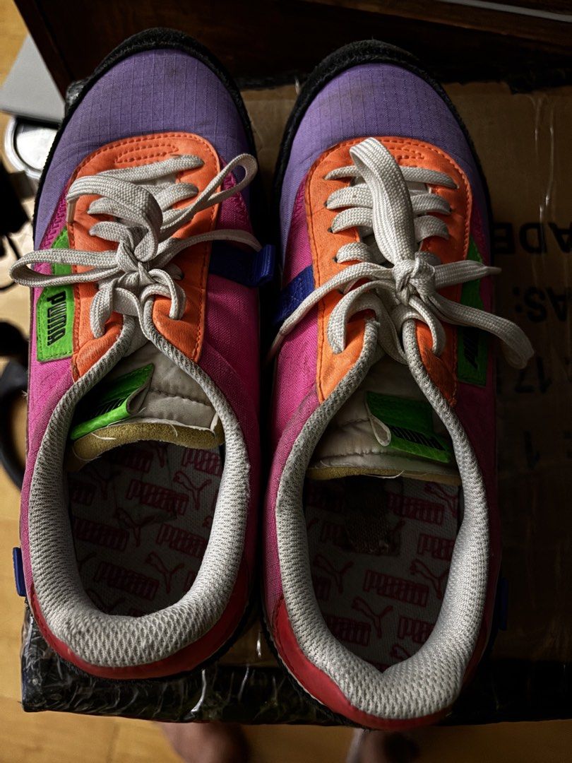 Puma Future Rider Play On Sneakers (Category: Sneakers) located in Quezon City. Submitted by dtzee (Listing ID 1440675398, Image 1). Description: - Puma Future Rider Play On sneakers - Vibrant multi-color design: purple, pink, orange, green accents - Clean white laces and soles - Iconic Puma branding on side and tongue - Perfect for everyday casual wear - Shows some signs of wear on soles and uppers Size 8.5US.