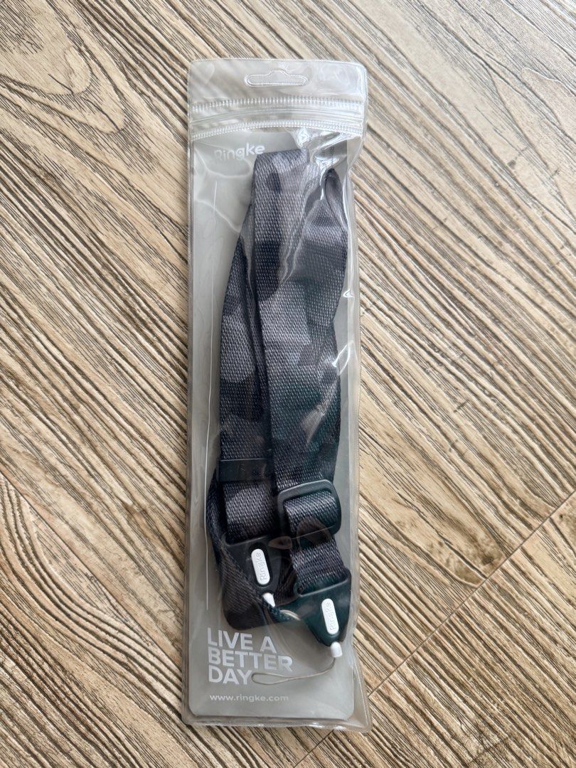 Ringke Camouflage Phone Lanyard Strap (Category: Other Mobile & Gadget Accessories) located in Pasig City. Submitted by thetravellingguyinstyle (Listing ID 1440718488, Image 1). Description: - Ringke lanyard strap - Stylish camouflage pattern - Adjustable strap for comfortable wear - Includes all necessary attachment pieces for your phone case - Used once, still in original packaging - Perfect for keeping your phone easily accessible and secure.