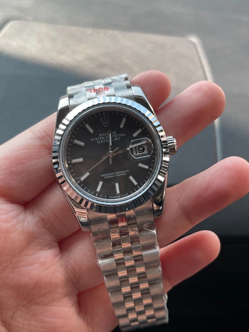 Rx Datejust Fluted Bezel Dark Dial Jubilee Bracelet (Category: Luxury Watches) located in Pasig City. Submitted by gheo0025 (Listing ID 1440721281, Image 3). Description: - Rx Datejust watch - Dark dial with date window - Fluted bezel - Jubilee bracelet - Protective plastic still on - Sharp appearance - Excellent timepiece with Orig box manual card paper bag.
