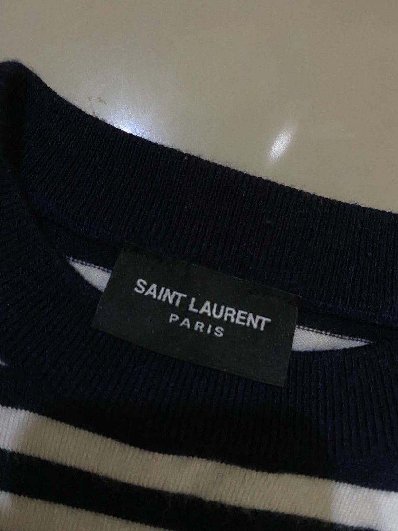Saint Laurent Paris Striped sweater (Category: Luxury Apparel) located in Manila. Submitted by livehorse.542a4e (Listing ID 1440663727, Image 3). Description: - Brand: Saint Laurent Paris - Color: Navy and White Stripes - Style: Crew neck, long sleeves - Features: Timeless, versatile for layering - Care: Refer to label - 27.5X20.