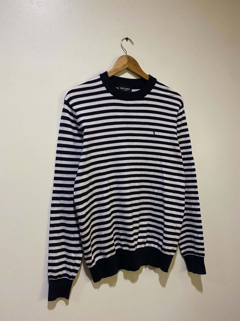 Saint Laurent Paris Striped sweater (Category: Luxury Apparel) located in Manila. Submitted by livehorse.542a4e (Listing ID 1440663727, Image 1). Description: - Brand: Saint Laurent Paris - Color: Navy and White Stripes - Style: Crew neck, long sleeves - Features: Timeless, versatile for layering - Care: Refer to label - 27.5X20.