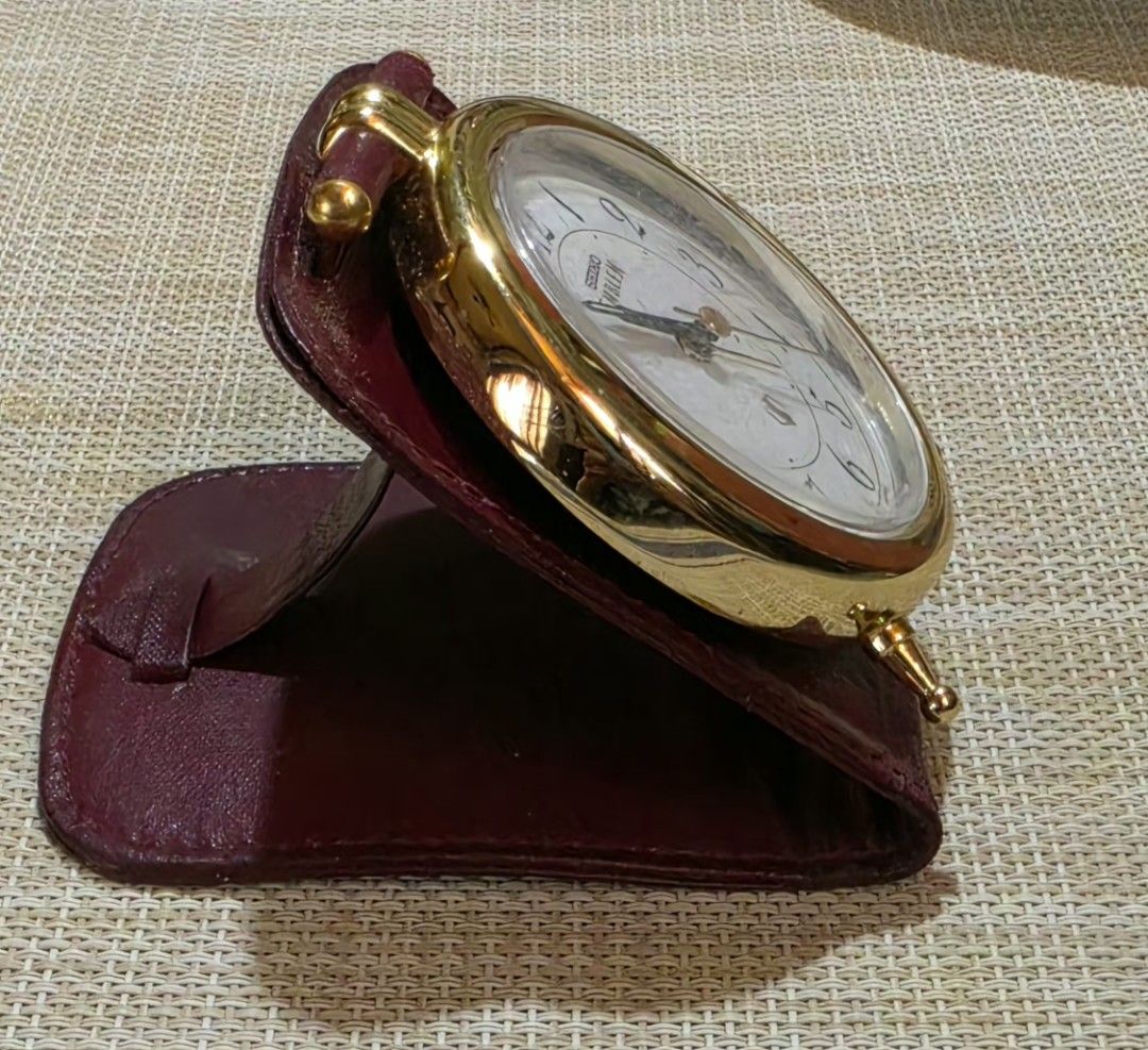 Seiko Emblem Gold Alarm Clock with Leather Case (Category: Clocks) located in Naga. Submitted by solamia (Listing ID 1440755068, Image 1). Description: - Vintage Seiko Emblem alarm clock - Gold tone casing with white face - Arabic numerals - Includes original burgundy leather travel case - Classic, timeless design - Ideal for desk or travel use.