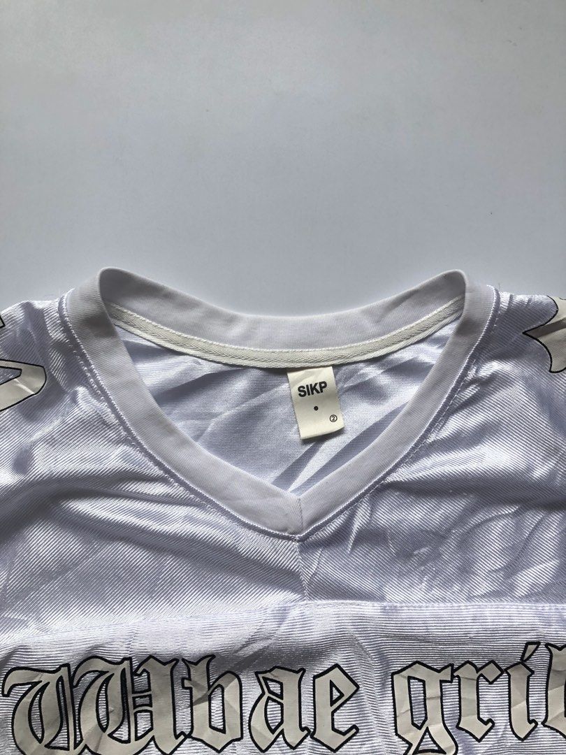 SIKP White 'Wbae Grill 24' Jersey (Category: Activewear) located in Angeles City. Submitted by thrift2wear.fit (Listing ID 1440720741, Image 2). Description: Width -20 Length - 25.5 Little dirt on print.