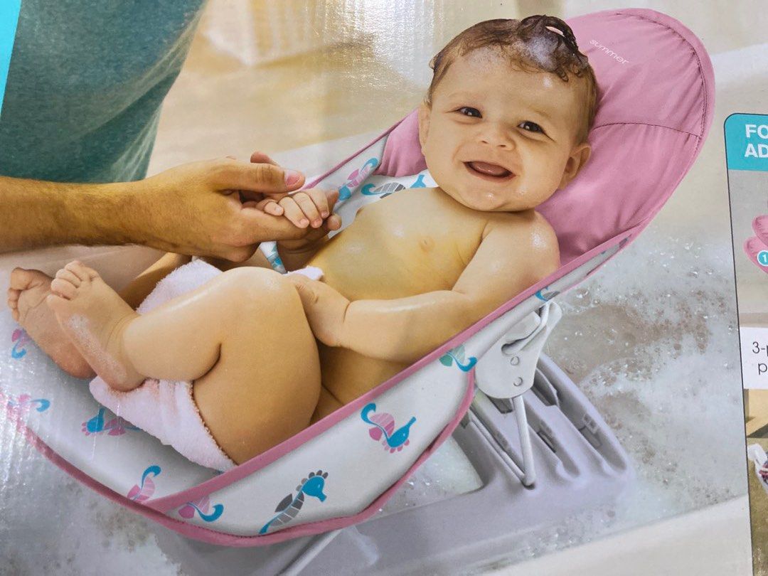 Summer Deluxe Baby Bather Folding Bath Sling (Category: Bathtub & Bath Accessories) located in Manila. Submitted by junjuns. (Listing ID 1440751702, Image 1). Description: - Deluxe baby bather in cute pink animal print. - Features a folding bath sling for added comfort and support. - 3-position recline and padded headrest for optimal baby positioning. - Folds flat for convenient storage and travel. - Designed for use in adult bathtubs. - Makes ba
