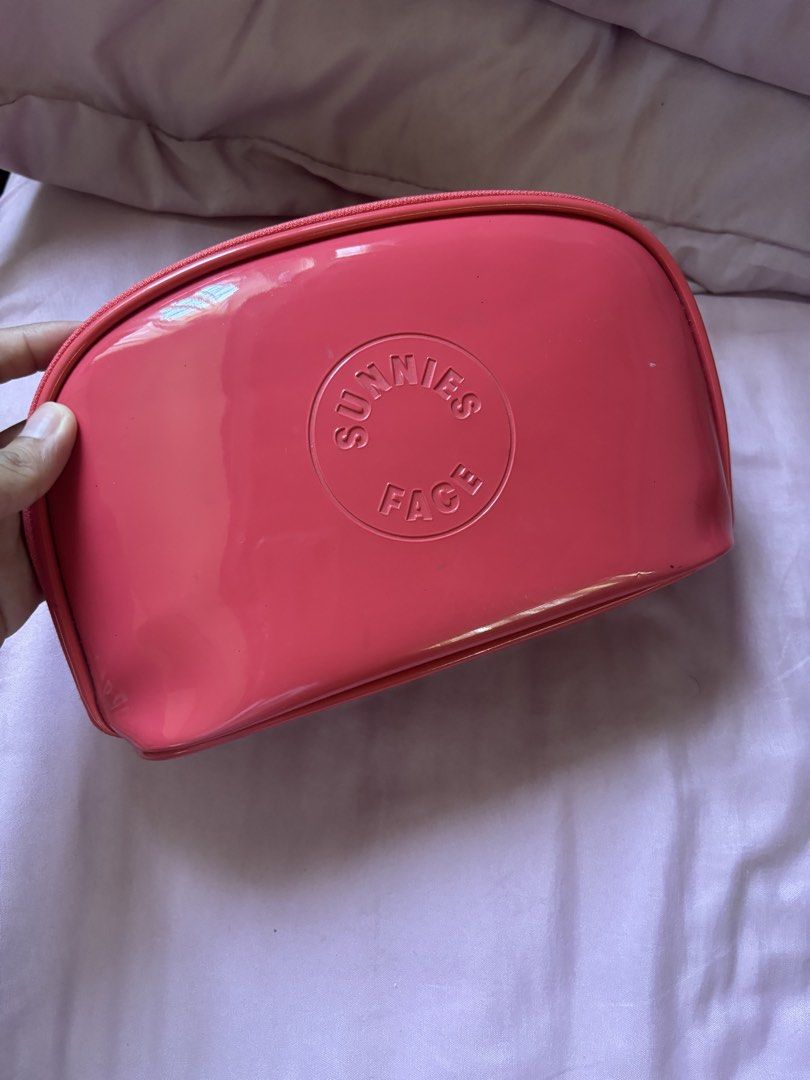 Sunnies Face Makeup Bag Coral Pink (Category: Makeup) located in Binan City. Submitted by kpreloved___ (Listing ID 1440603572, Image 3). Description: - Coral pink makeup bag from Sunnies Face - Patent finish - Zipper closure - Ideal for organizing makeup essentials.