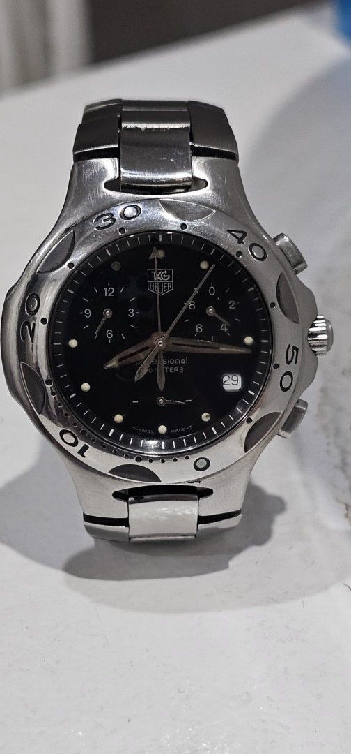 TAG Heuer Kirium Chronograph Watch (Category: Men's Watches) located in Manila. Submitted by watchphil (Listing ID 1440743359, Image 1). Description: Selling TAG Heuer Kirium watch. Black dial with chronograph functions. Stainless steel bracelet. Date window at 3 o'clock. Rotating bezel with minute markers. Great for everyday wear or special occasions..