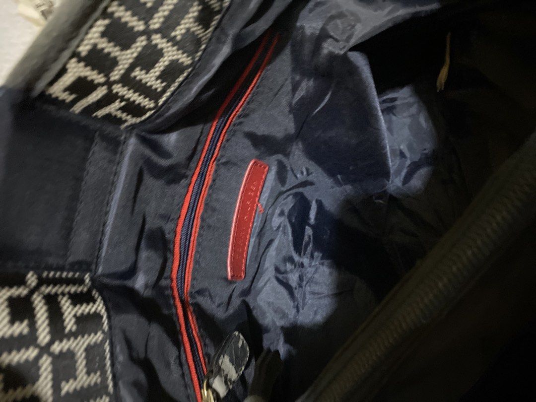 Tommy Hilfiger Monogram Tote Bag with Chain Straps (Category: Tote Bags) located in Bacoor. Submitted by arianne_domingo17 (Listing ID 1440748859, Image 3). Description: - Authentic Tommy Hilfiger tote bag - All-over TH monogram print - Black and white stripes on the sides - Gold chain and leather shoulder straps - Central Tommy Hilfiger logo hardware - Spacious interior - Ideal for everyday use - Has small stain at the back but not noticeable - 