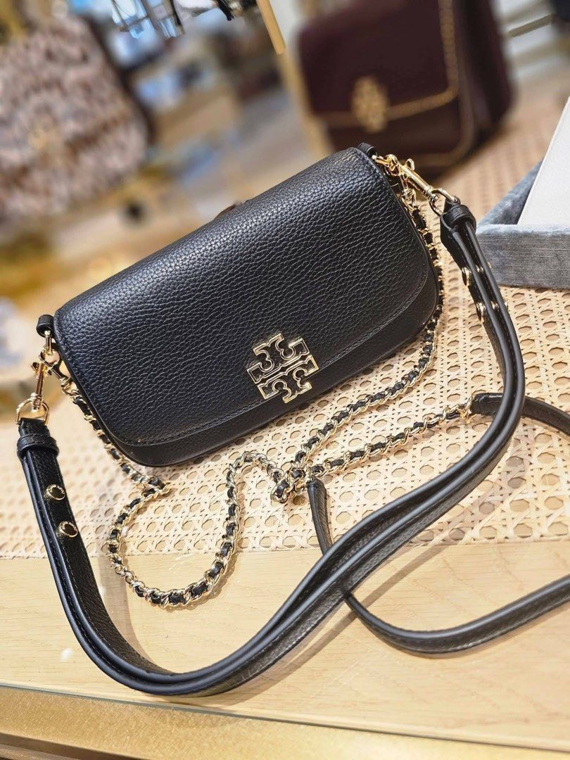 Tory Burch Britten Convertible Shoulder Bag (Category: Cross-body Bags) located in Las Pinas. Submitted by abby022 (Listing ID 1440746502, Image 1). Description: - Authentic Tory Burch shoulder bag in classic black leather. - Elegant gold chain strap with comfortable leather detailing. - Signature Tory Burch logo prominently displayed on the front flap. - Compact and stylish, ideal for both evening events and everyday use..