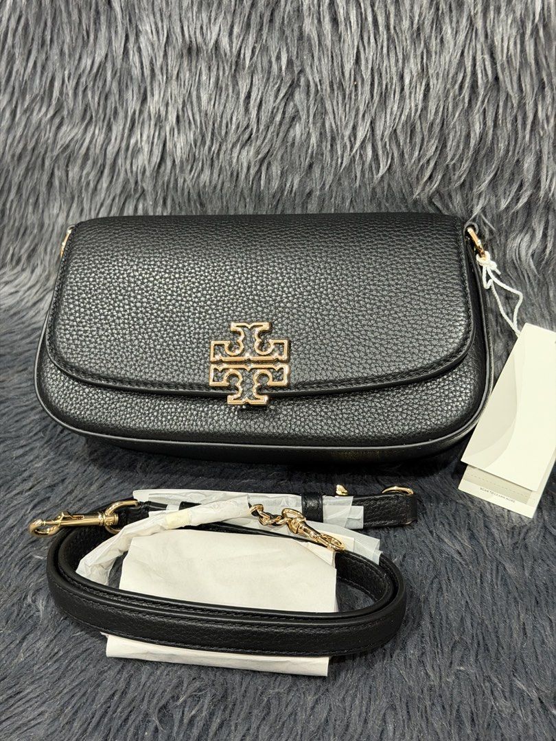 Tory Burch Britten Convertible Shoulder Bag (Category: Cross-body Bags) located in Las Pinas. Submitted by abby022 (Listing ID 1440746502, Image 2). Description: - Authentic Tory Burch shoulder bag in classic black leather. - Elegant gold chain strap with comfortable leather detailing. - Signature Tory Burch logo prominently displayed on the front flap. - Compact and stylish, ideal for both evening events and everyday use..