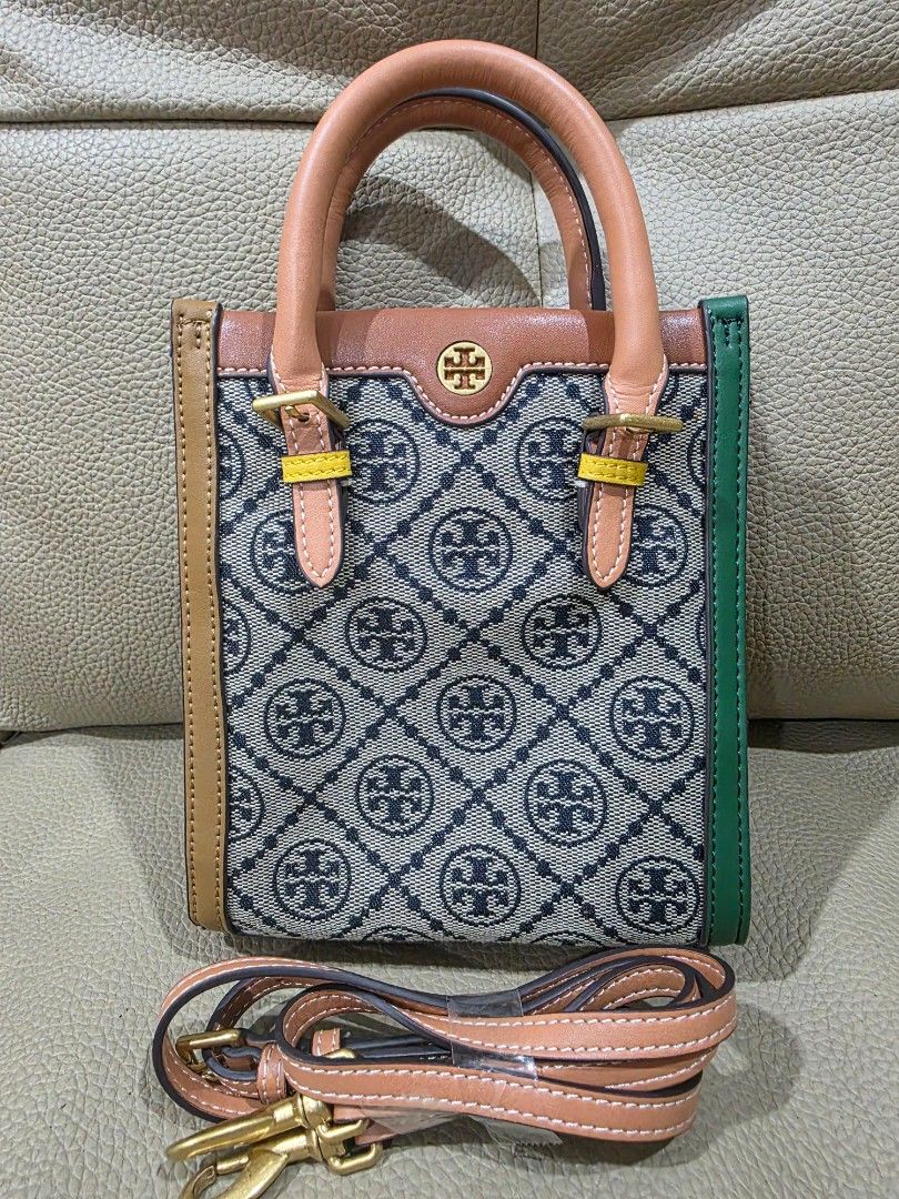 Tory Burch Monogram Mini Tote Bag (Category: Luxury Bags & Wallets) located in Quezon City. Submitted by amcreationz.store (Listing ID 1440665231, Image 1). Description: - Cute Tory Burch mini tote - Classic monogram pattern - Detachable crossbody strap included - Leather handles and trim - Green accent at the top - Ideal for everyday use or a night out.