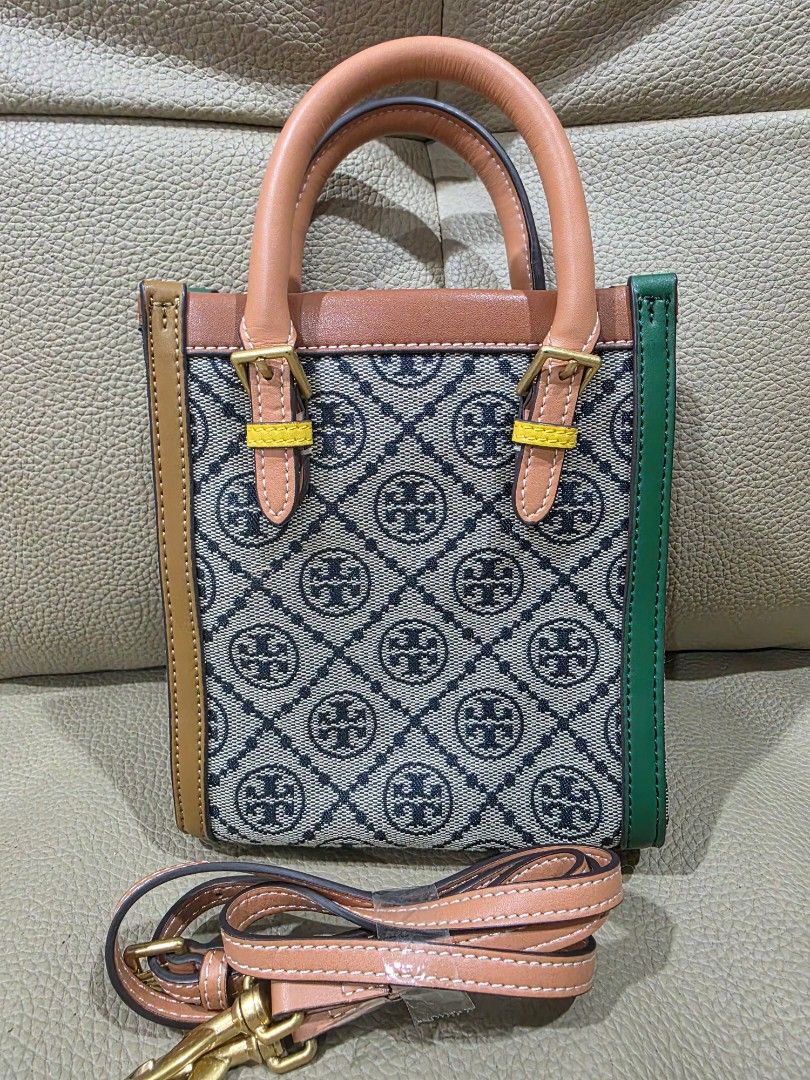 Tory Burch Monogram Mini Tote Bag (Category: Luxury Bags & Wallets) located in Quezon City. Submitted by amcreationz.store (Listing ID 1440665231, Image 3). Description: - Cute Tory Burch mini tote - Classic monogram pattern - Detachable crossbody strap included - Leather handles and trim - Green accent at the top - Ideal for everyday use or a night out.