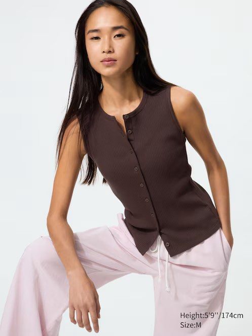 Uniqlo Brown Button-Up Sleeveless Top (Category: Sleeveless) located in Malolos. Submitted by luvvtinx (Listing ID 1440750069, Image 1). Description: Brand new! Never worn Medium on tag - Brown ribbed sleeveless top - Button-up front - Comfortable and stretchy material - Versatile for layering or wearing on its own - Easily styled with jeans or trousers for casual or dressy outfits.