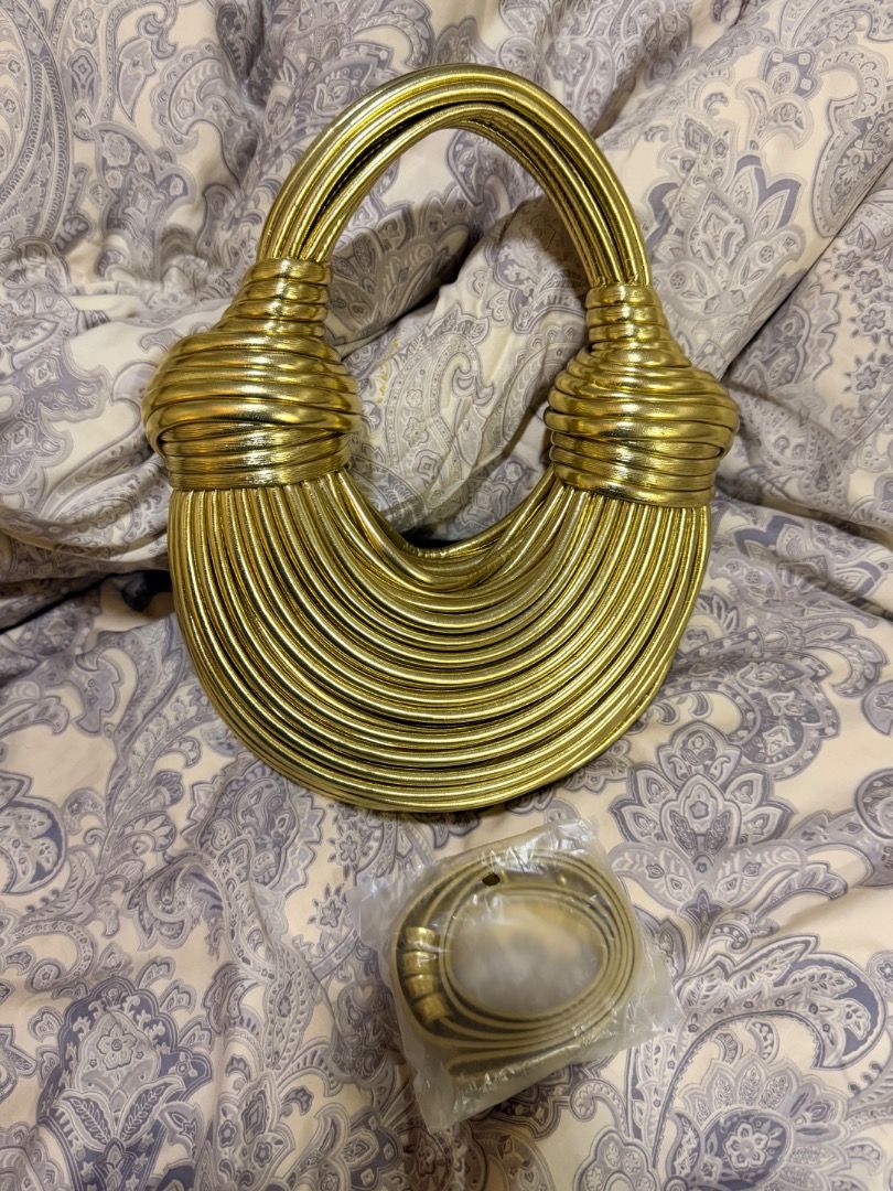 Unique Gold Woven Handbag with Detachable Strap (Category: Purses & Pouches) located in Manila. Submitted by mitch_declutterzzz0713 (Listing ID 1440725564, Image 2). Description: - Like new, used once only - Zipper working, clean bag - Stunning gold handbag with intricate woven design. - Features a secure interior zipper closure. - Comes with a detachable strap for versatile styling (shoulder bag or handle carry). - Elevate any outfit with this e