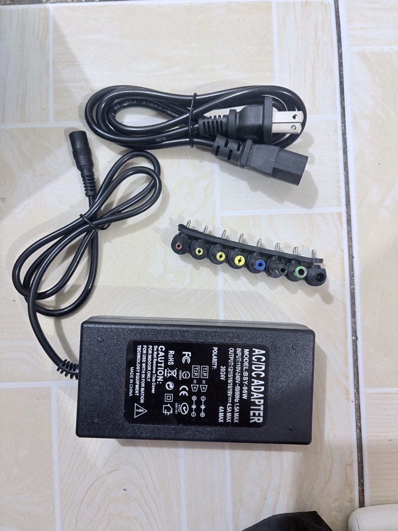 Universal Notebook Power Adapter 96W with 8 Swappable Connectors (Category: Chargers) located in Manila. Submitted by fiercetree-6b01 (Listing ID 1440751948, Image 3). Description: - Universal notebook power adapter - 96 Watt output - Compatible with 12-24V input - Comes with 8 interchangeable connectors for different laptop models - Power rating table and compatibility details available in photos.