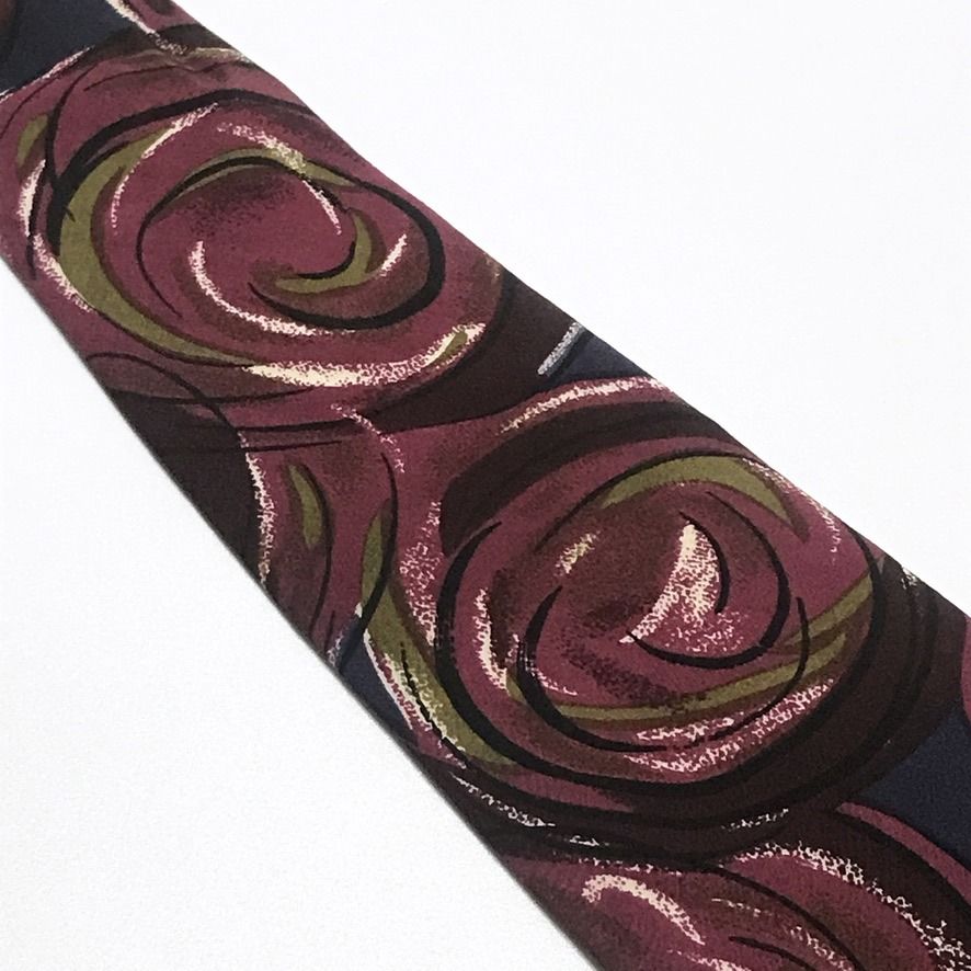 Valo Roso Abstract Florals Hand Made Necktie (Category: Ties) located in Taguig. Submitted by retrogaze (Listing ID 1440742840, Image 3). Description: This Valo Roso handmade necktie is beautifully crafted from 100% silk, showcasing a deep and elegant dark blue base. It features a stunning, artistically bold large abstract painted florals pattern that flows gracefully across the blade. The vibrant botanical motifs combine expressive strokes of ri