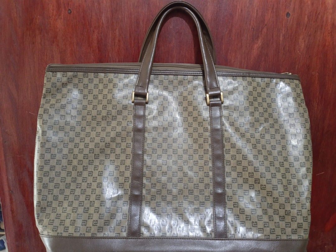 Vintage Pierre Balmain Labyrinth Monogram Travelling Bag (Category: Luxury Bags & Wallets) located in San Jose del Monte. Submitted by m_nshop (Listing ID 1440646582, Image 1). Description: - Classic monogram tote bag - Brown leather trim and handles - Spacious interior for essentials - Ideal for travel or everyday use - Dimensions: Approx. 18" W x 12" H - Handle drop: Approx. 6" FROM JAPAN AUCTION NO COD NO LBC LALAMOVE OR JNT COURIER ONLY.