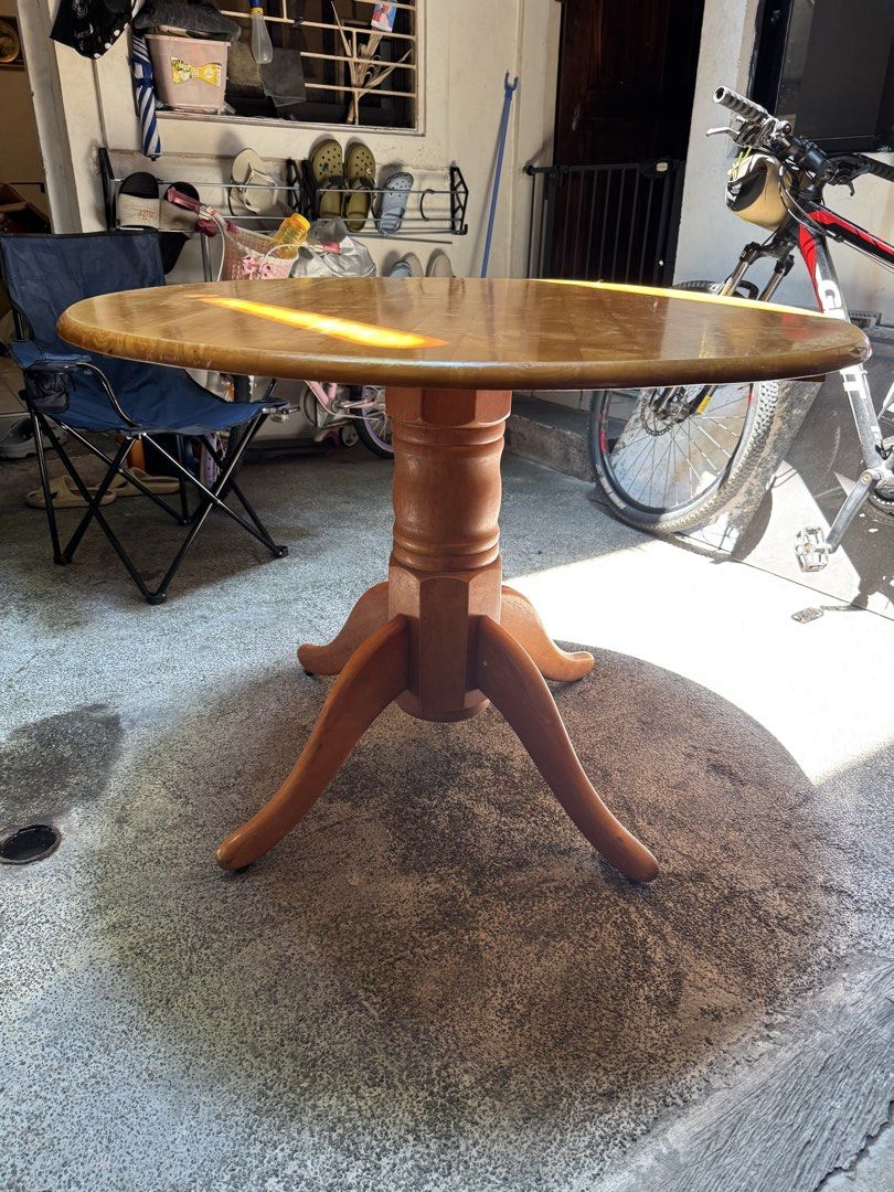 Vintage Round Dining Table (Category: Tables & Sets) located in Manila. Submitted by prpalma (Listing ID 1440605844, Image 3). Description: - Diameter: 107cm; Height: 77cm - Round wooden dining table. - Sturdy pedestal base with four legs. - Warm, natural wood finish. - Made in Malaysia. - Ideal for small dining areas or breakfast nooks..